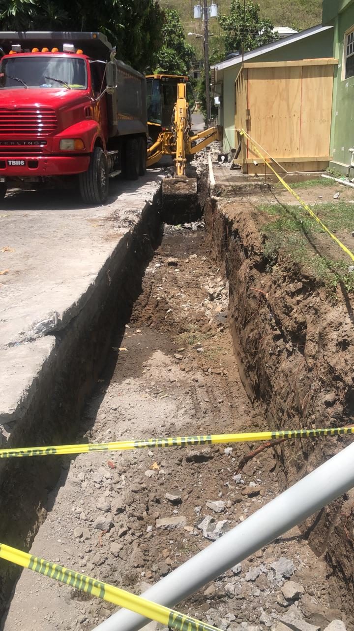 Excavated trench with caution tape