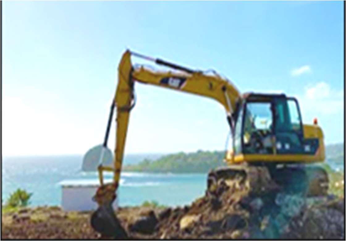 Caterpillar excavator working on a Kingstown coastal site