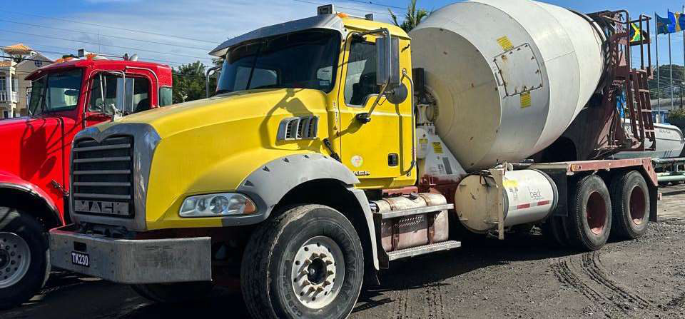 Yellow concrete mixer truck
